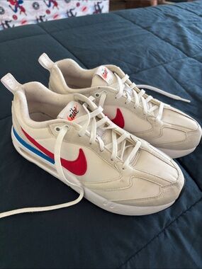 Nike White Sneakers with Red Swoosh and Blue Accent